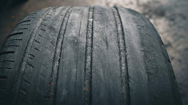 Editorial illustration for Wheel Alignment Symptoms Decoded: Which Angle Is Causing Your Tire Wear or Steering Trouble?